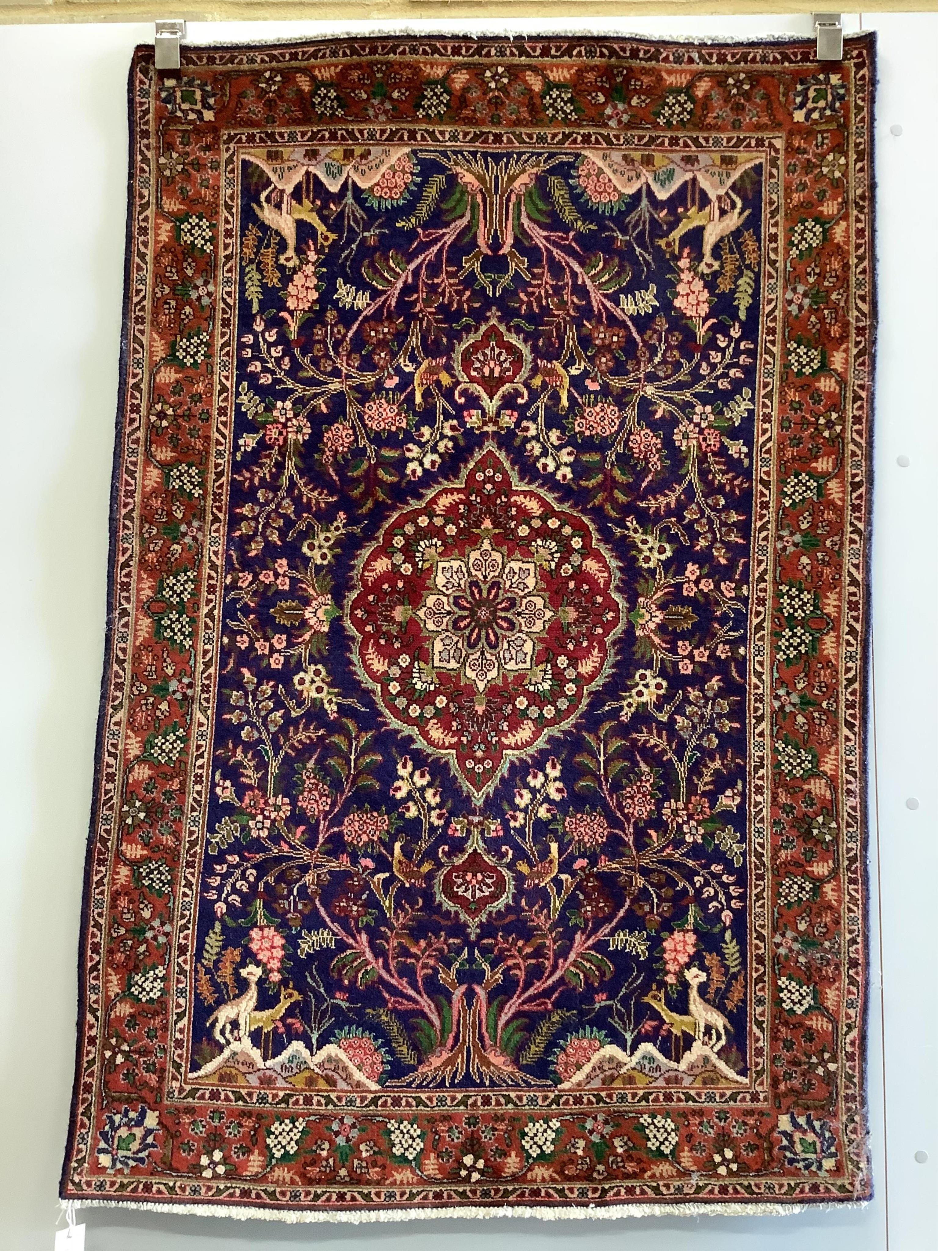 A Qom blue ground rug, 150 x 98cm. Condition - good